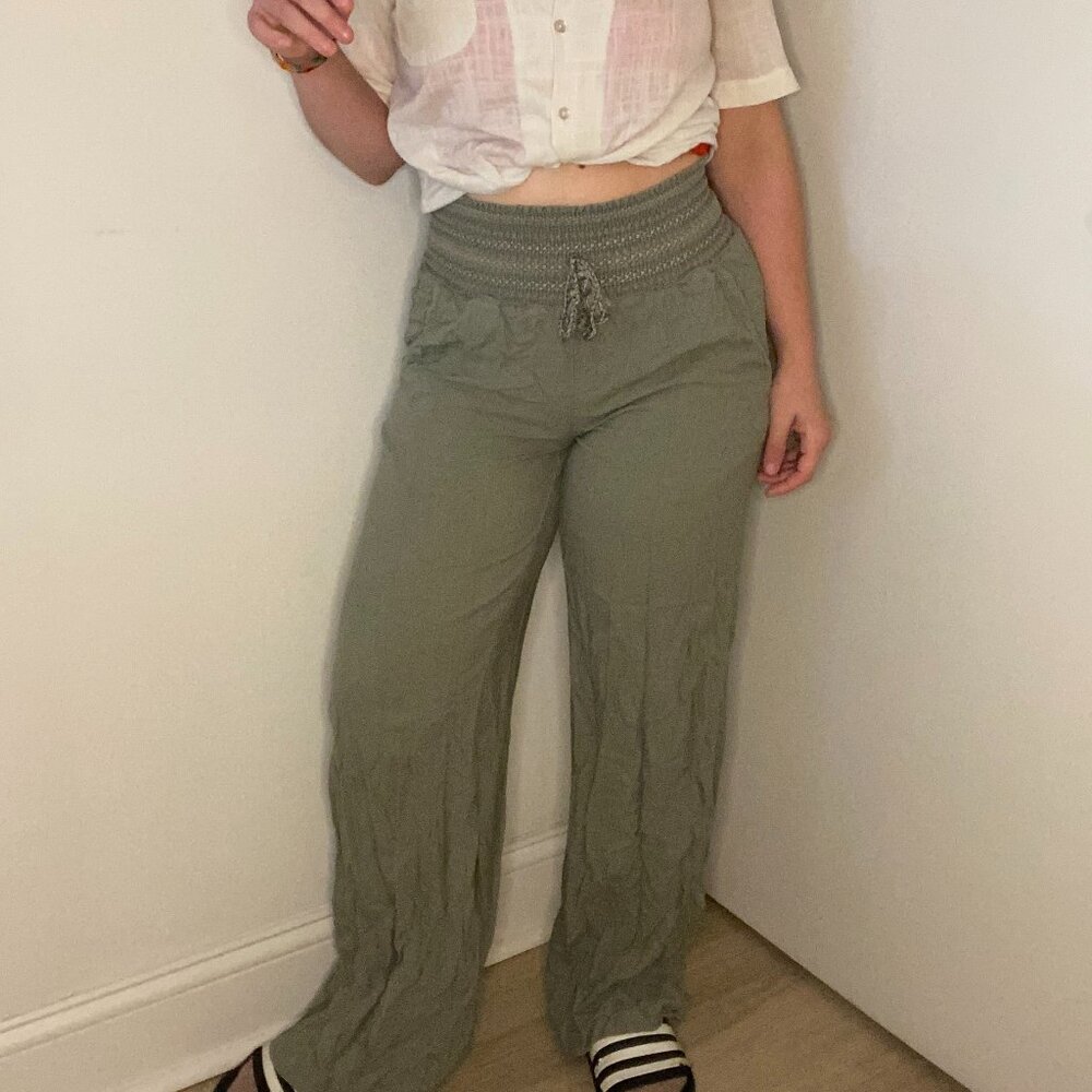 Olive green flowy pants with stretchy waist with pockets